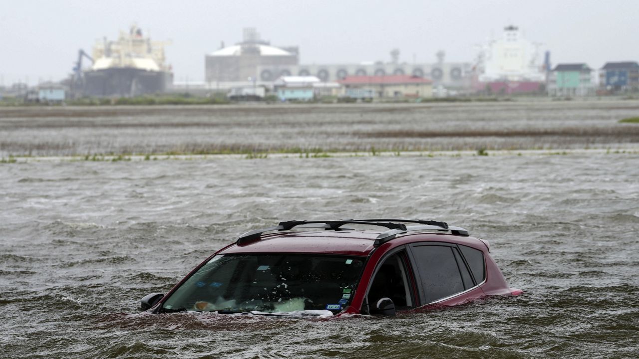 A car sits submerged in water as Tropical Storm Alberto approaches land Wednesday, June 19, 2024, in Surfside Beach, Texas. (Jon Shapley/Houston Chronicle via AP)