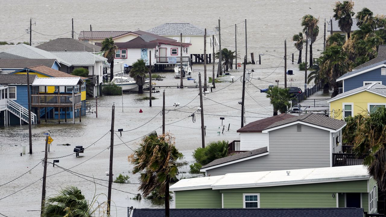 The storm surge from Tropical Storm Alberto, floods the streets in Surfside Beach, Texas, Wednesday, June 19, 2024. (Jon Shapley/Houston Chronicle via AP)