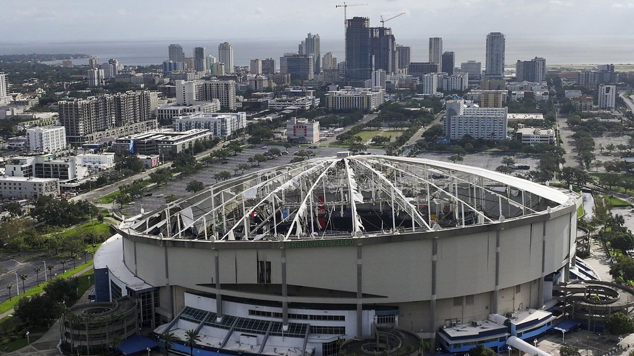 An aerial drone view of Tropicana Field with the roof shredded after Hurricane Milton with downtown St. Petersburg in the background on Thursday morning, Oct. 10, 2024. (Dirk Shadd/Tampa Bay Times via AP)