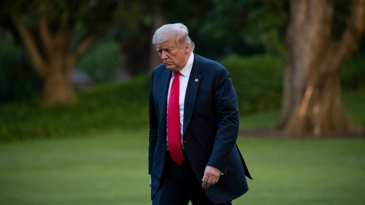 President Donald Trump walks across the White House lawn (AP Image/File)