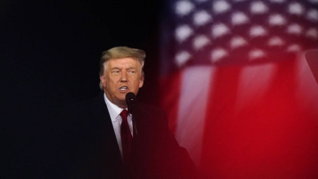 President Donald Trump speaks at a campaign rally in support of Senate candidates Sen. Kelly Loeffler, R-Ga., and David Perdue in Dalton, Ga., Monday, Jan. 4, 2021. (AP Photo/Brynn Anderson)