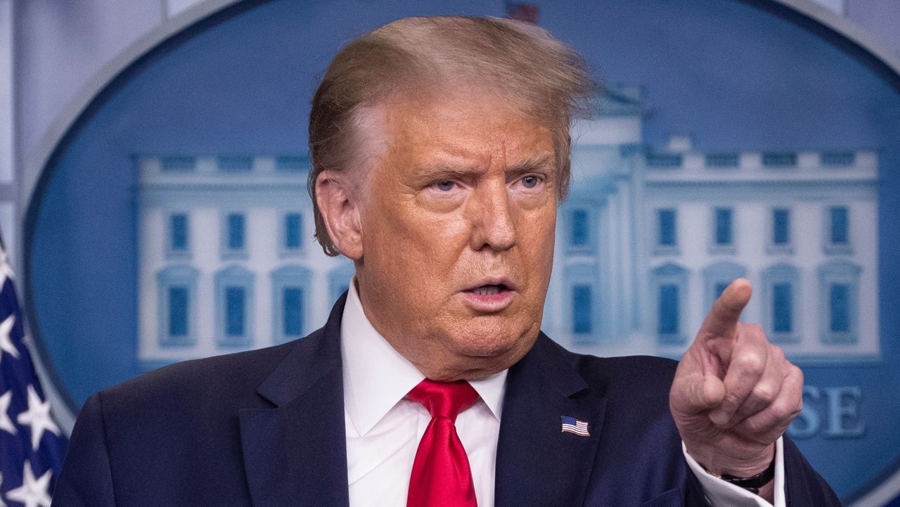 President Donald Trump points to a question as he speaks during a briefing with reporters in the James Brady Press Briefing Room of the White House, in Washington. (AP Photo/Alex Brandon)