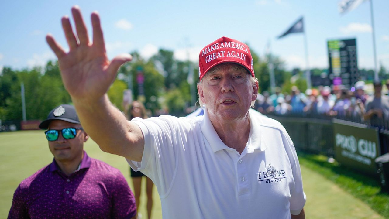 Former President Donald Trump greets supporters and sign autographs during the final round of the Bedminster Invitational LIV Golf tournament at his golf course in Bedminster, N.J., Aug. 13, 2023. (AP Photo/Seth Wenig, File) 