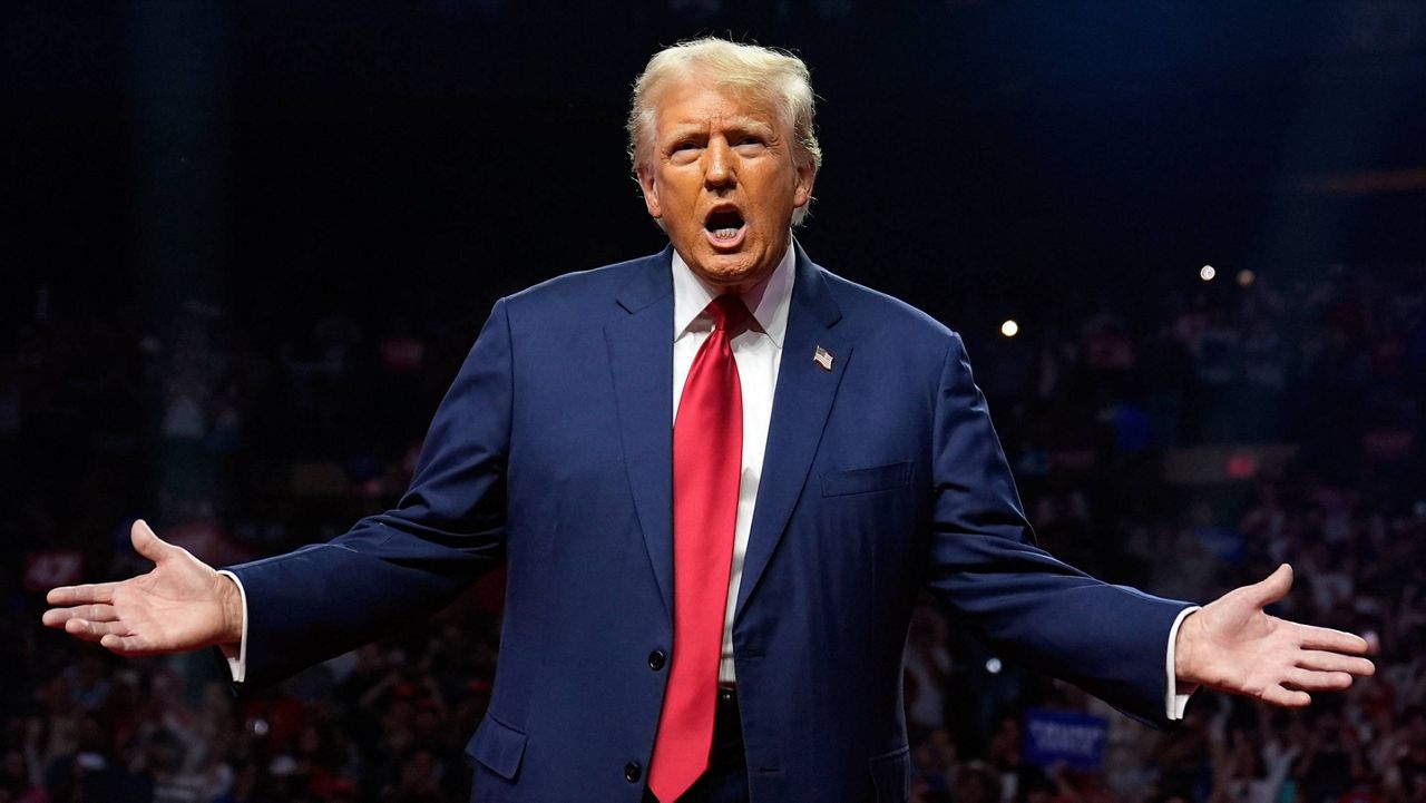 Republican presidential nominee and former President Donald Trump gestures at a campaign rally at the Desert Diamond Arena, Friday, Aug. 23, 2024, in Glendale, Ariz. (AP Photo/Evan Vucci)