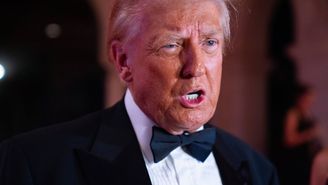 President-elect Donald Trump speaks to reporters before a New Year's Eve party at Mar-a-Lago, Tuesday, Dec. 31, 2024, in Palm Beach, Fla. (AP Photo/Evan Vucci)