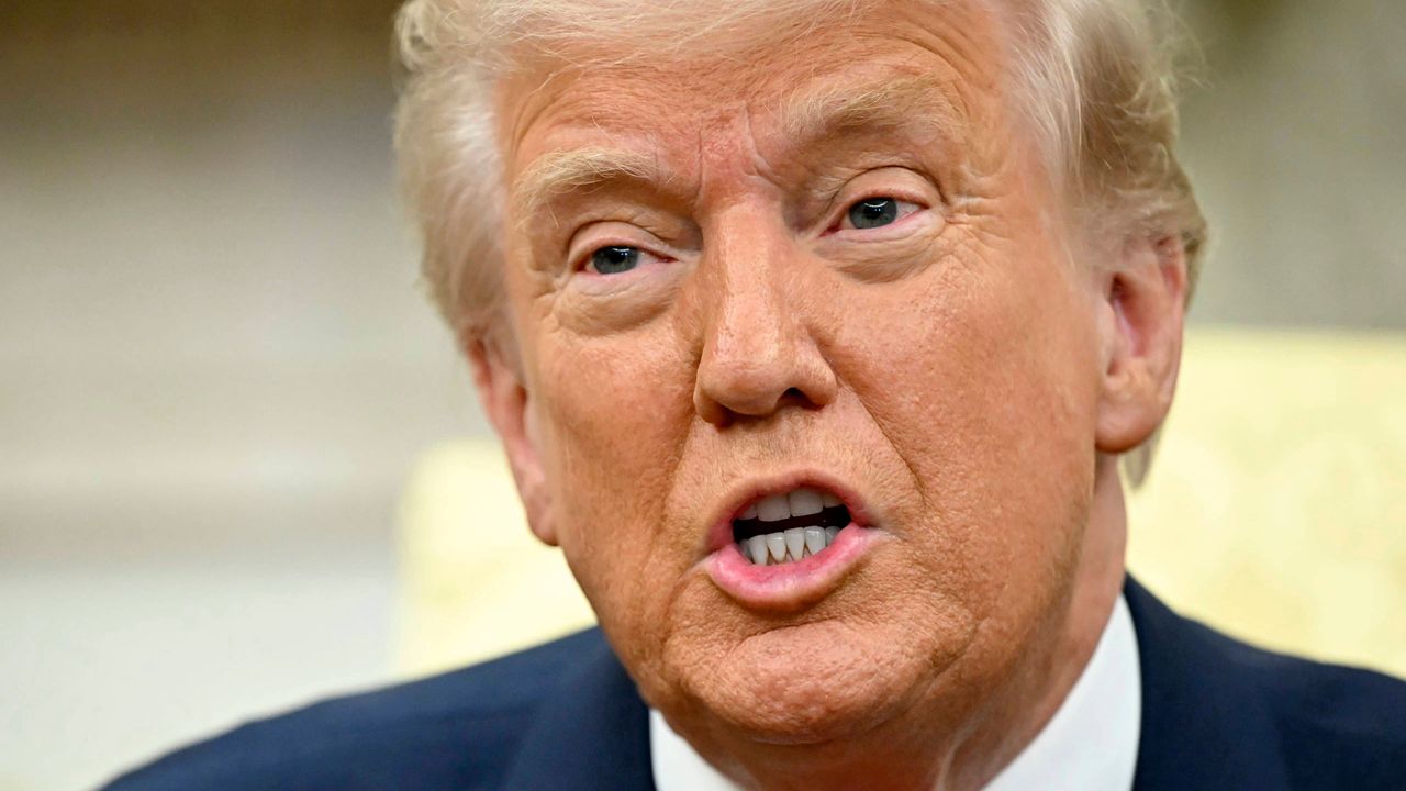 President Donald Trump speaks to reporters at the White House in Washington, Thursday, March 13, 2025. (Pool via AP)