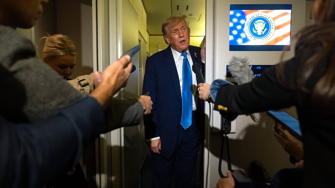 President Donald Trump speaks with reporters while flying aboard Air Force One en route from Calgary, Canada to Joint Base Andrews, Md., late Monday, June 16, 2025. (AP Photo/Mark Schiefelbein)