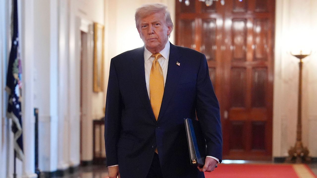 President Donald Trump arriving before speaking at a ceremony to sign the 
