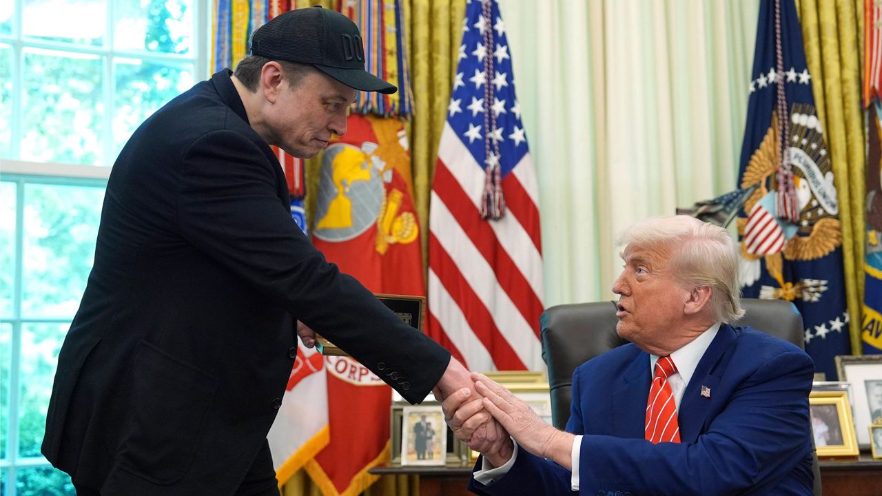 President Donald Trump shakes hands with Elon Musk during a news conference in the Oval Office of the White House, Friday, May 30, 2025, in Washington. (AP Photo/Evan Vucci)