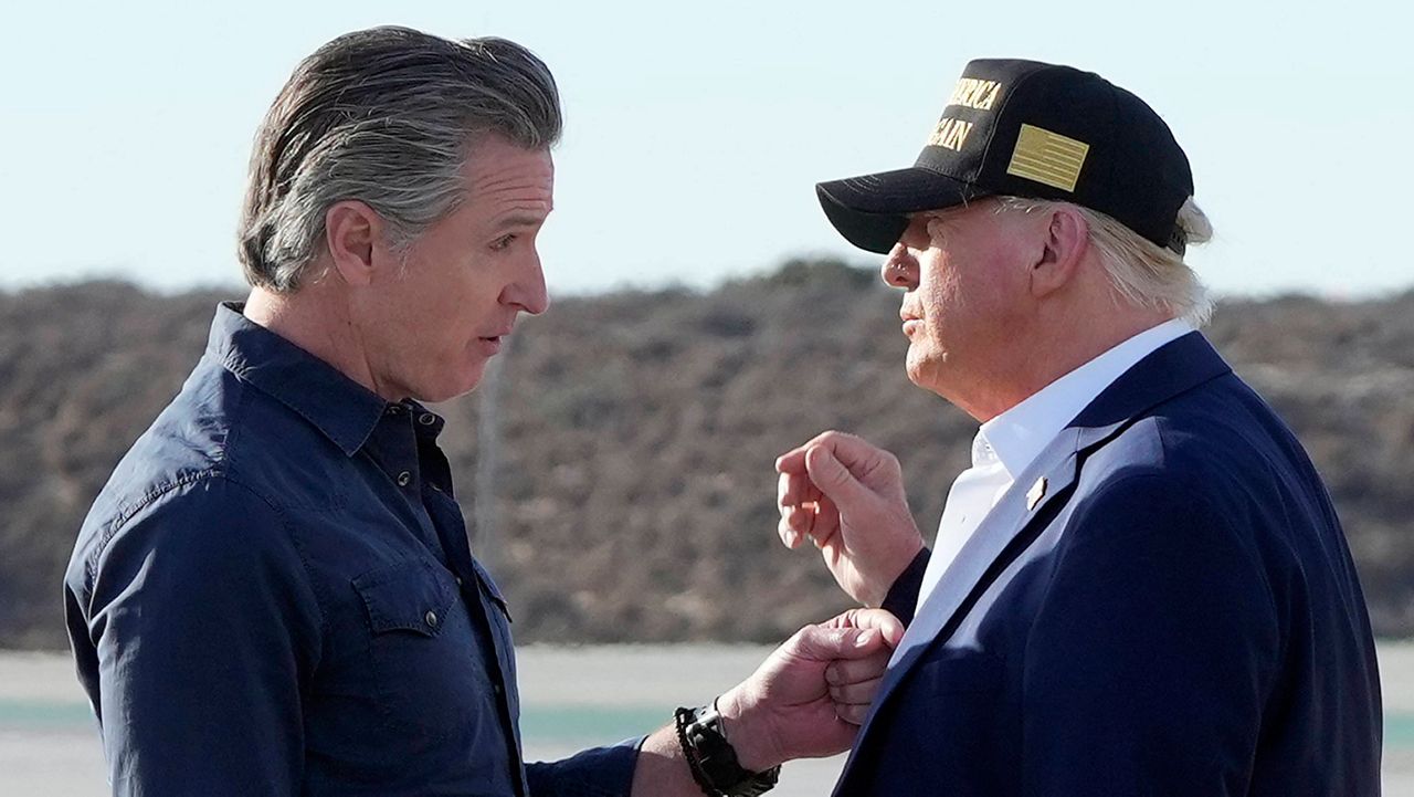 President Donald Trump talks with California Gov. Gavin Newsom after arriving on Air Force One at Los Angeles International Airport in Los Angeles, Jan. 24, 2025. (AP Photo/Mark Schiefelbein, File)