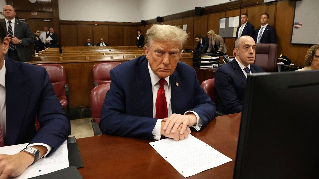 Former President Donald Trump speaks to the media as he arrives for the second day of jury selection at Manhattan criminal court, Tuesday, April 16, 2024, in New York. (Michael M. Santiago/Pool Photo via AP)