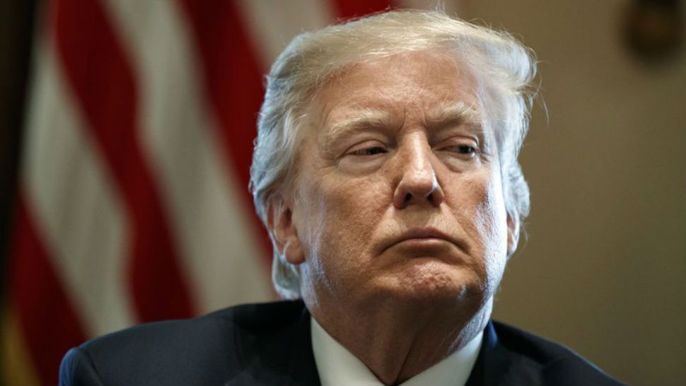 In this Jan. 9, 2018 file photo President Donald Trump listens during a meeting with lawmakers on immigration policy in the Cabinet Room of the White House in Washington. (AP Photo/Evan Vucci)