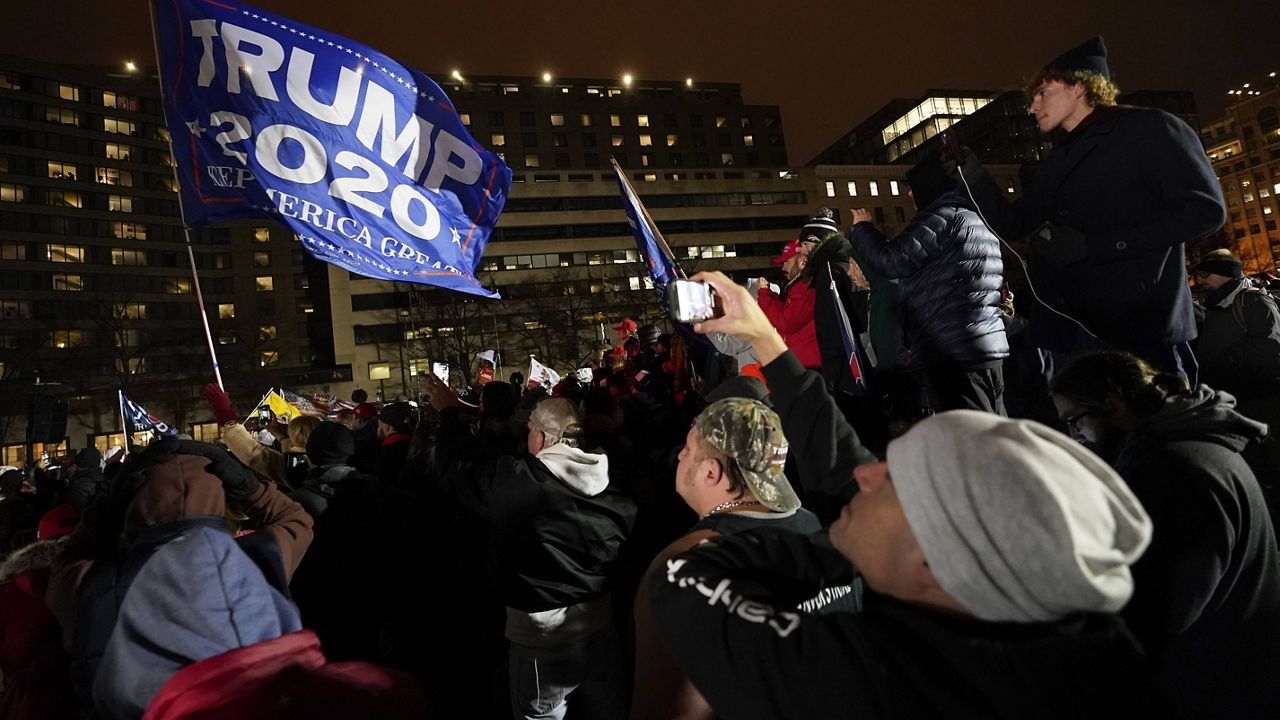 People attend a rally at Freedom Plaza on Tuesday in Washington, D.C., in support of President Donald Trump. (AP Photo/Julio Cortez)