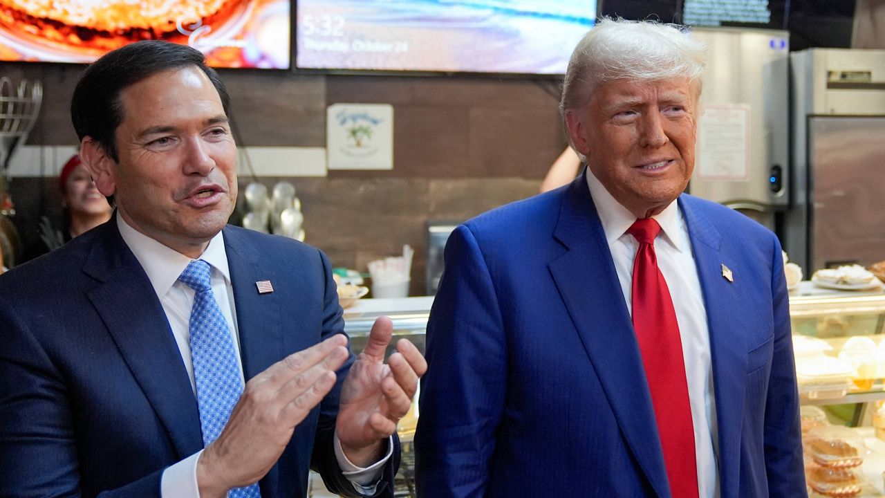 Republican presidential nominee former President Donald Trump stands with Sen. Marco Rubio, R-Fla., left, during a campaign stop at Havana Express Cuban Kitchen and Bakery, Thursday, Oct. 24, 2024, in Las Vegas. (AP Photo/Alex Brandon)