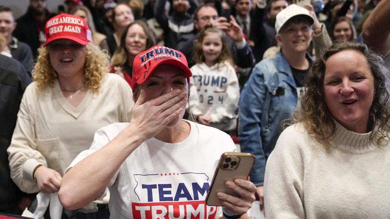 Supporters react as Republican presidential candidate former President Donald Trump arrives to speak at a rally at Simpson College in Indianola, Iowa, Sunday, Jan. 14, 2024. (AP Photo/Andrew Harnik)