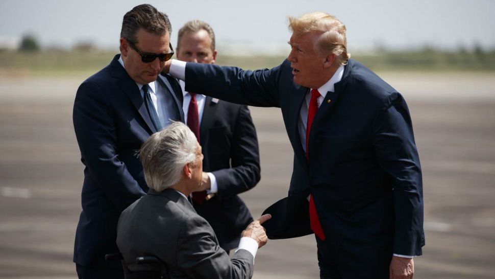 President Donald Trump talks with Sen. Ted Cruz, R-Texas, left, and Gov. Greg Abbott, R-Texas, after arriving at Ellington Field Joint Reserve Base, Thursday, May 31, 2018, in Houston. (AP Photo/Evan Vucci)
