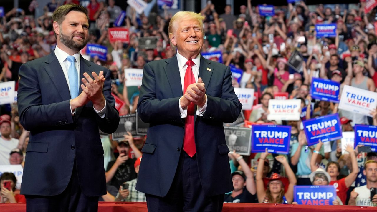 Republican presidential candidate former President Donald Trump and Republican vice presidential candidate Sen. JD Vance, R-Ohio, arrive at a campaign rally, Saturday, July 20, 2024, in Grand Rapids, Mich. (AP Photo/Evan Vucci)