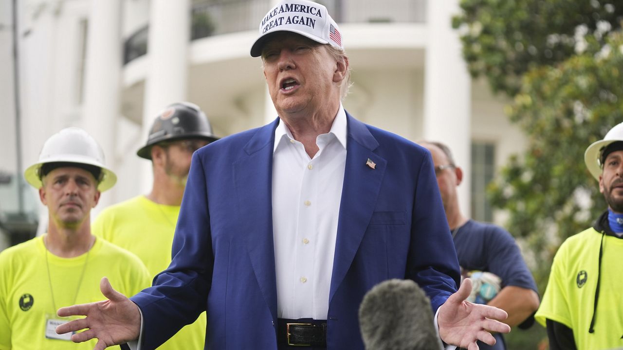 President Donald Trump speaks as a flag pole is installed on the South Lawn of the White House, Wednesday, June 18, 2025, in Washington. (AP Photo/Evan Vucci)