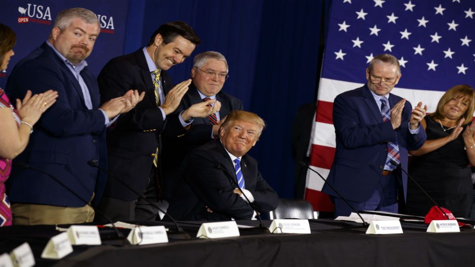 Trump bashes immigration at tax cut event
