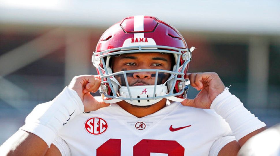 Alabama quarterback Tua Tagovailoa (13) adjusts his helmet before an NCAA college football game against Mississippi State in Starkville, Miss., Saturday, Nov. 16, 2019. (AP Photo/Rogelio V. Solis)