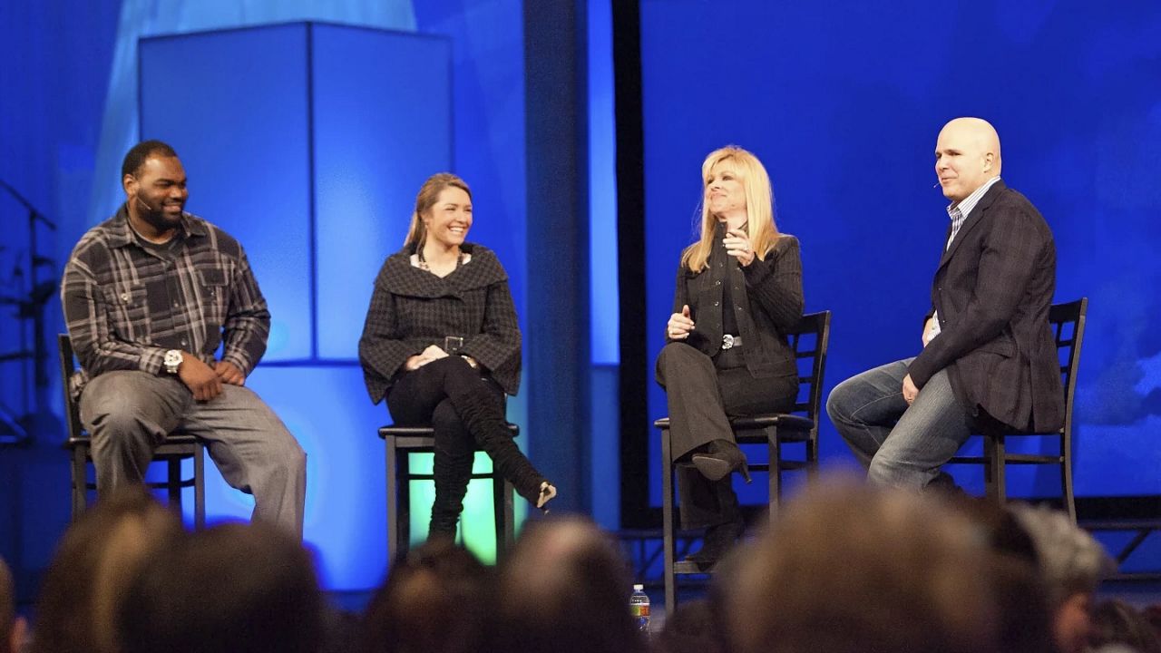 Michael Oher, left, Collins Tuohy, second from left, and Leigh Anne Tuohy, whose lives are portrayed in the Oscar-nominated movie "The Blind Side," speak with Pastor Kerry Shook, right, March 3, 2010 at Woodlands Church's Fellowship Campus in The Woodlands, TX. Michael Oher, the former NFL tackle known for the movie “The Blind Side,” filed a petition Monday, Aug. 14, 2023, in a Tennessee probate court accusing Sean and Leigh Anne Tuohy of lying to him by having him sign papers making them his conservators rather than his adoptive parents nearly two decades ago. (AP Photo/The Courier, Eric S. Swist, File)