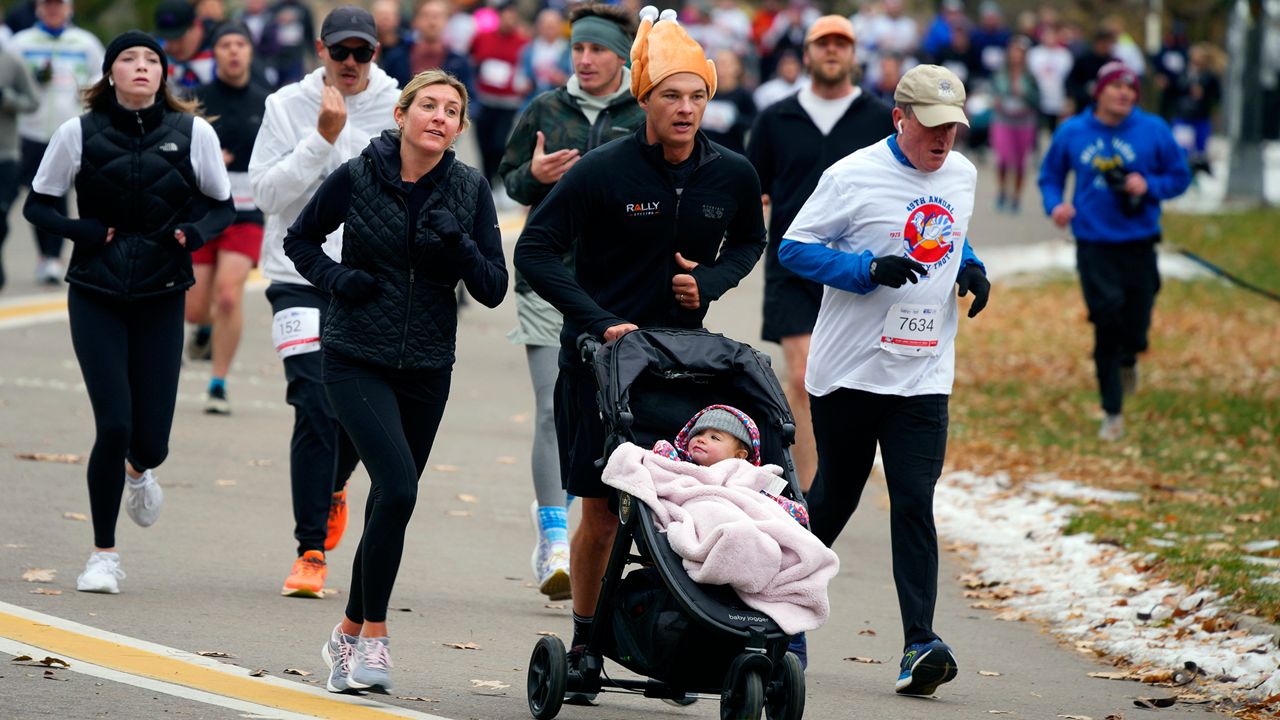 Runners take part in the 49th annual Mile High United Way Turkey Trot in southeast Denver on Nov. 24, 2022. (AP Photo/David Zalubowski, File)