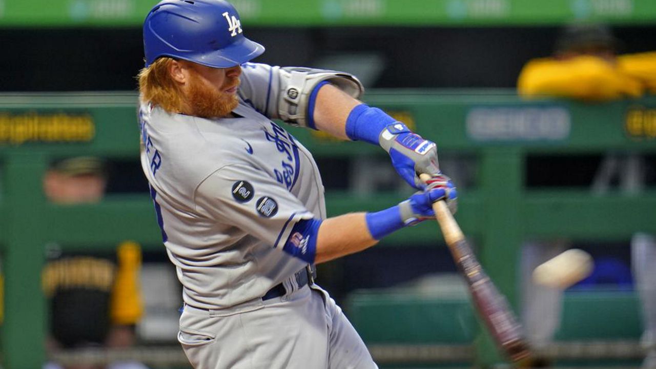 Los Angeles Dodgers' Justin Turner hits a solo home run off Pittsburgh Pirates starting pitcher Tyler Anderson during the first inning of a baseball game in Pittsburgh, Wednesday, June 9, 2021. (AP Photo/Gene J. Puskar)