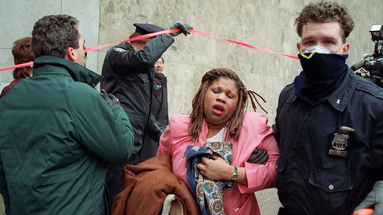 A police officer assists a survivor of the World Trade Center terrorist bombing in New York on Feb. 26, 1993.