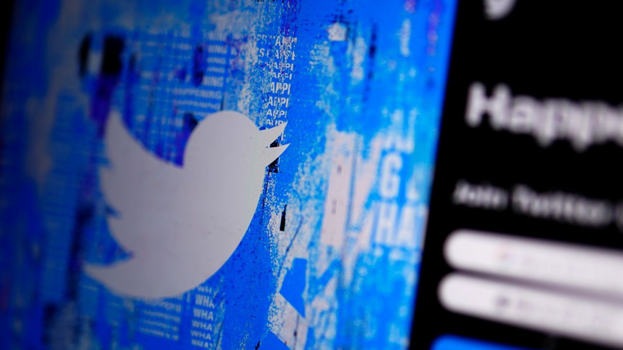 The Twitter splash page is seen on a digital device on April 25. (AP Photo/Gregory Bull)