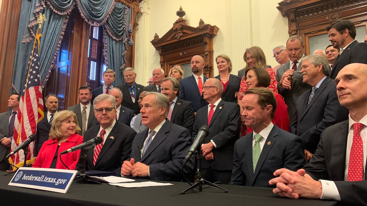 Texas Gov. Greg Abbott appears with legislators in this file image. (Spectrum News 1/Niki Griswold)