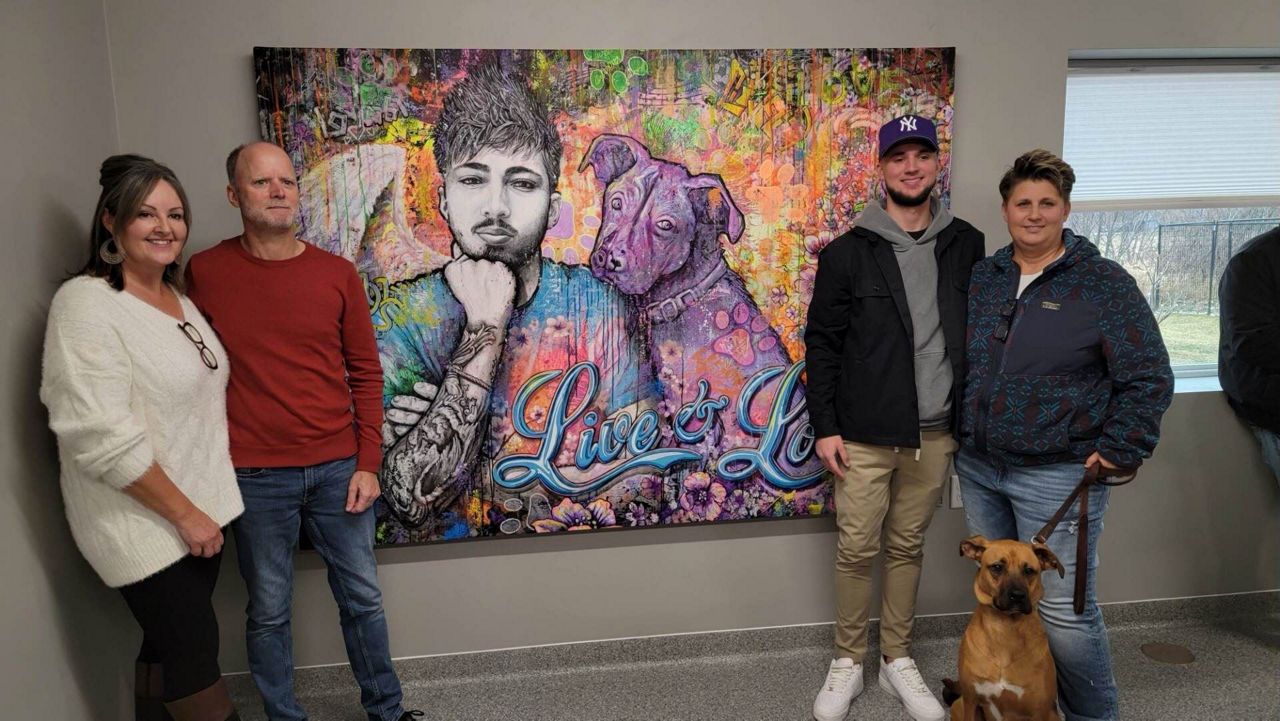 A mural of Tyler Anderson, done by local artist Andrew Linskens, now hangs at Saving Paws Animal Rescue.