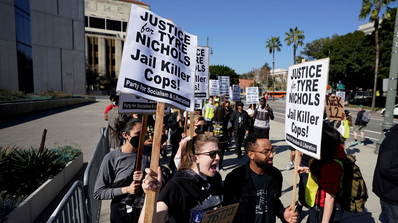 Demonstrators picket outside of LAPD headquarters on Saturday, Jan. 28, 2023 in Los Angeles.