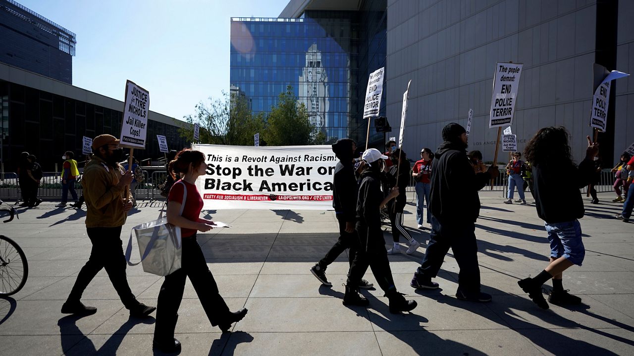 Demonstrators picket outside of LAPD headquarters Saturday, Jan. 28, 2023, in Los Angeles during a protest over the death of Tyre Nichols, who died after being beaten by Memphis, Tenn., police. (AP Photo/Marcio Jose Sanchez)
