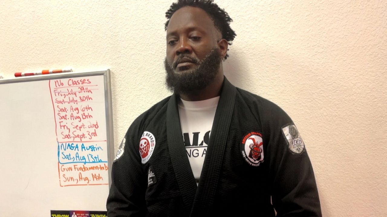 Centex Combatives and Fitness owner Tyrus Cooks looks on as his students train. (Spectrum News 1/Victor Jaymes)