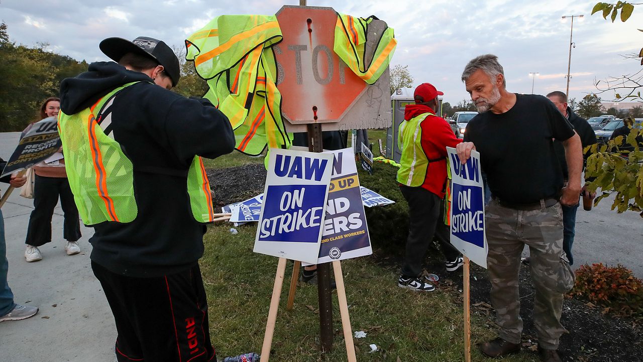 Auto workers escalate strike, walking out at Ford's largest factory and threatening Stellantis