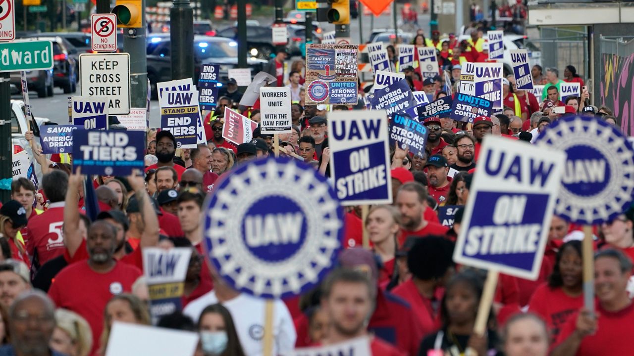 United Auto Workers members march through downtown Detroit, Friday, Sept. 15, 2023. (AP Photo/Paul Sancya)