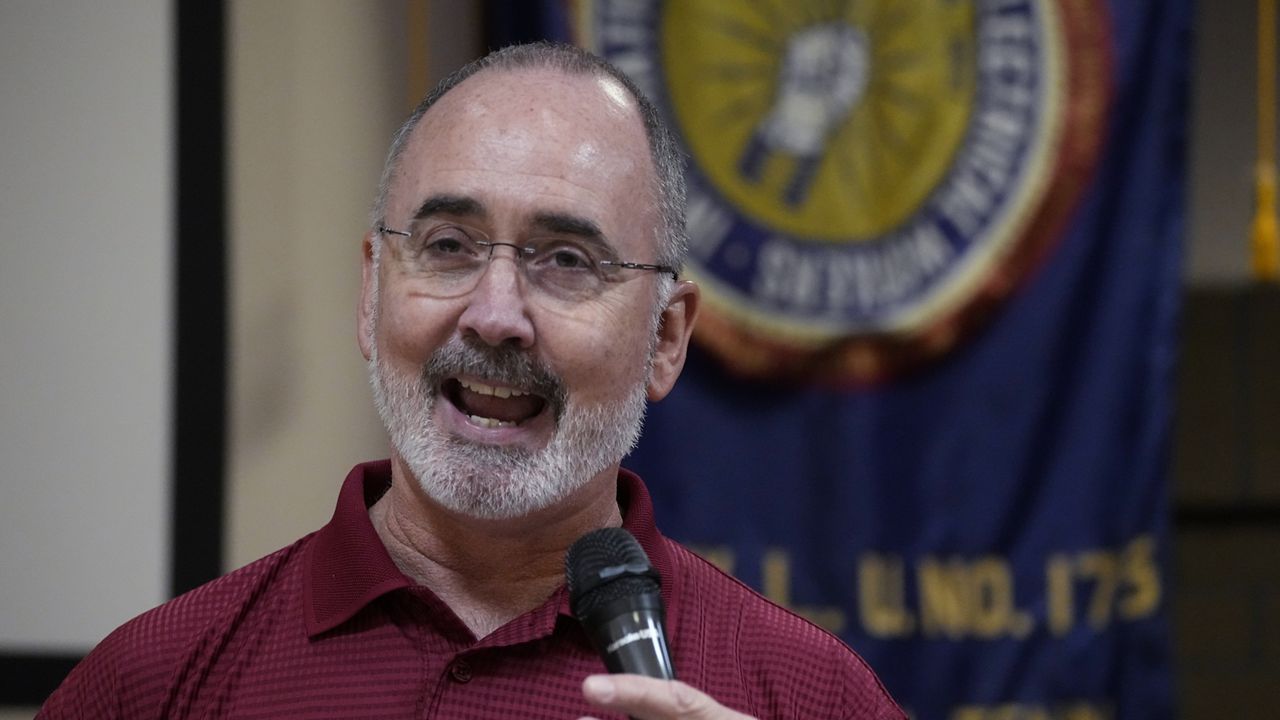 United Auto Workers President Shawn Fain speaks to Volkswagen auto workers Friday, April 19, 2024, in Chattanooga, Tenn., after workers at a VW factory voted to join the UAW. (AP Photo/George Walker IV)