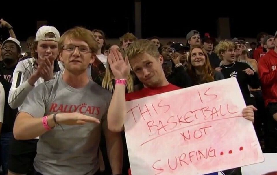 Jacob Mrohs (L) is a member of the RallyCats, a student-led supporter section at UC sporting events. (Photo courtesy of RallyCats)