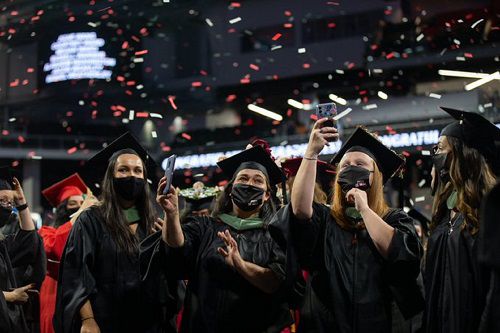 Photo of the youngest UC graduates celebrating (provided by University of Cincinnati)