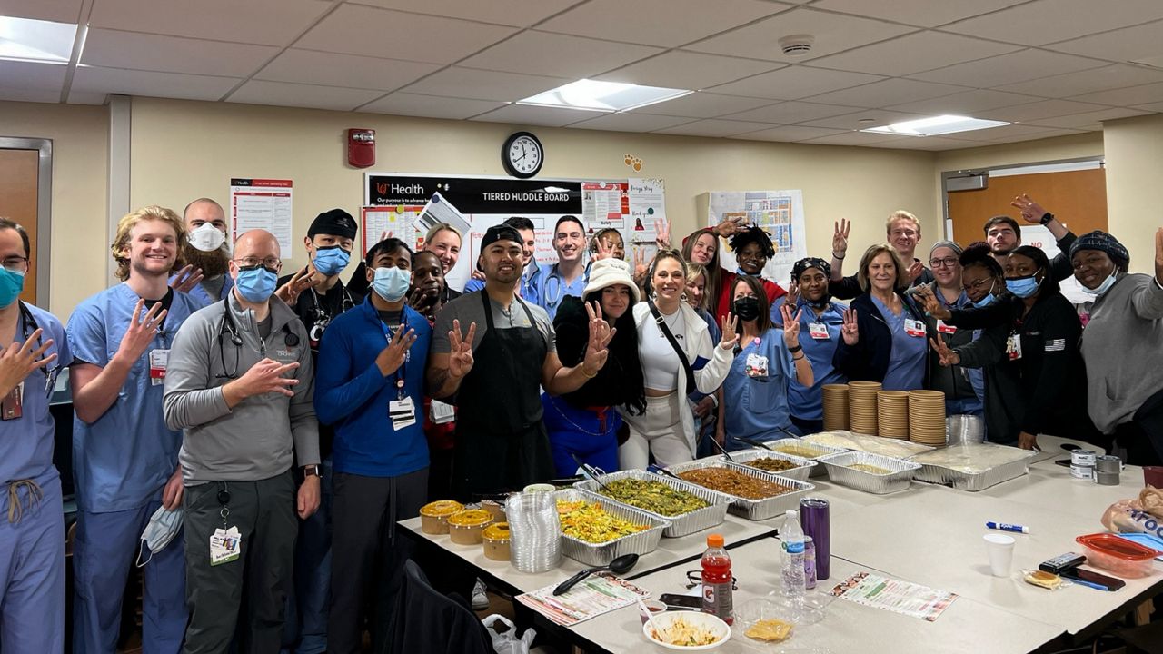 University of Cincinnati Medical Center staff hold up three fingers in support of Damar Hamlin. A Buffalo-based business owner delivered food in support of the injured Bills football player. (Photo courtesy of Madeline Hall)