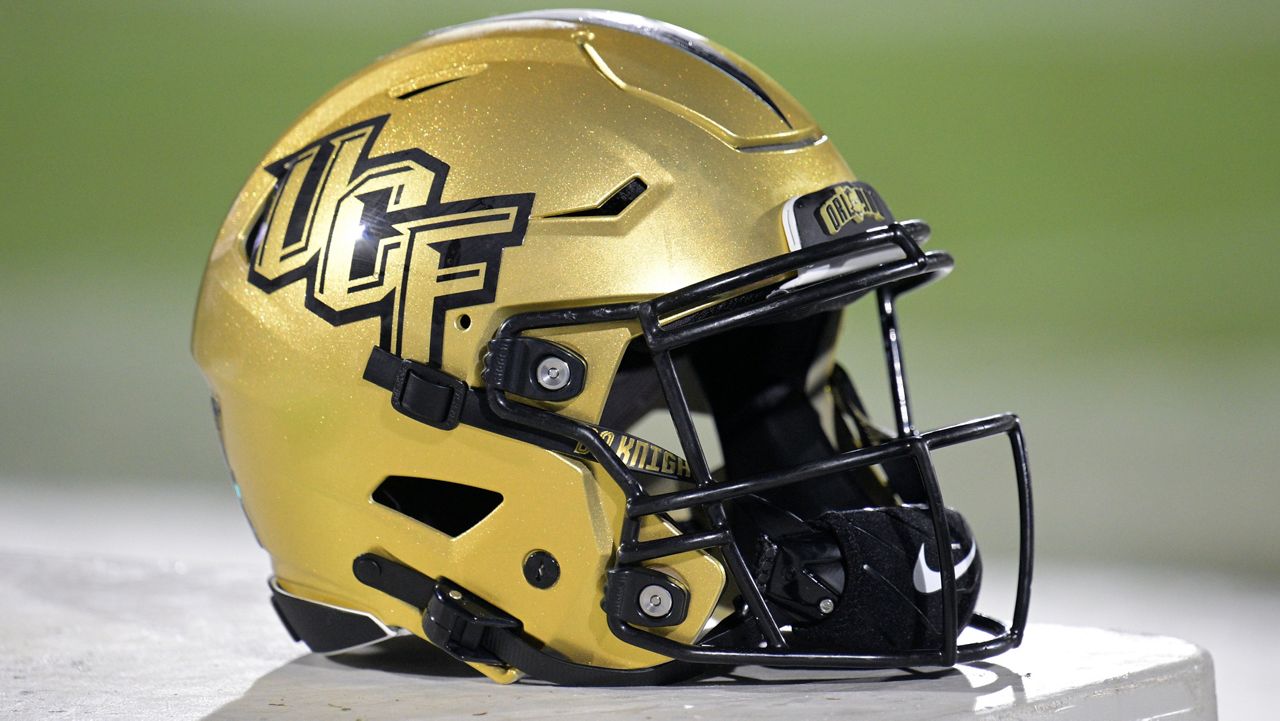 Central Florida helmet sits in the bench area on the sideline during the second half of an NCAA college football game against Kent State, Thursday, Aug. 31, 2023, in Orlando, Fla. (AP Photo/Phelan M. Ebenhack)