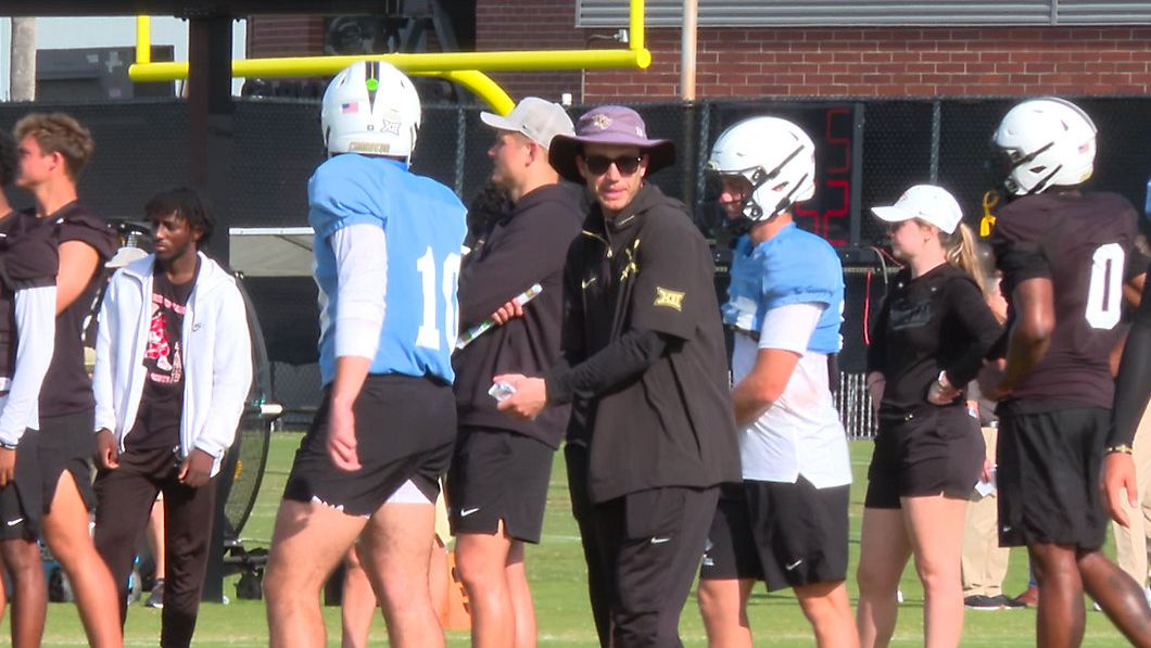 University of Central Florida quarterback coach McKenzie Milton gives instructions during a drill at spring practice. (Spectrum News)