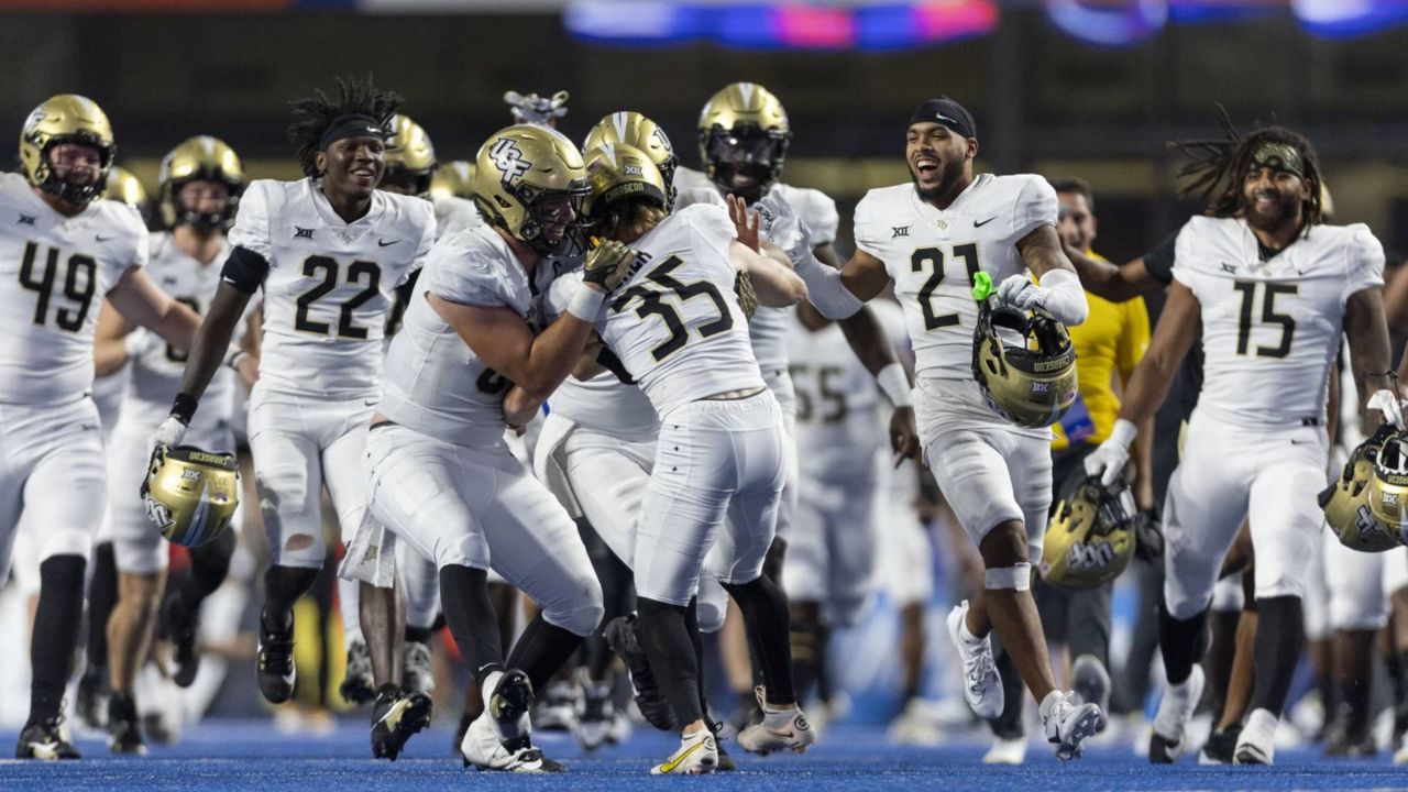 Central Florida kicker Colton Boomer is swarmed by teammates after he made a field goal to defeat Boise State during an NCAA college football game Saturday, Sept. 9, 2023, in Boise, Idaho. (Darin Oswald/Idaho Statesman via AP)