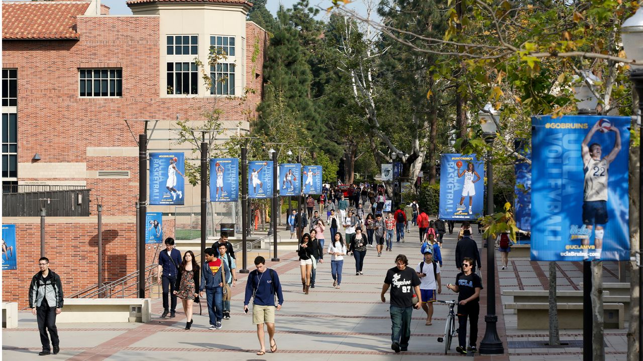 In this Feb. 26, 2015, file photo, students walk on the UCLA campus in Los Angeles.  (AP Photo/Damian Dovarganes, File)