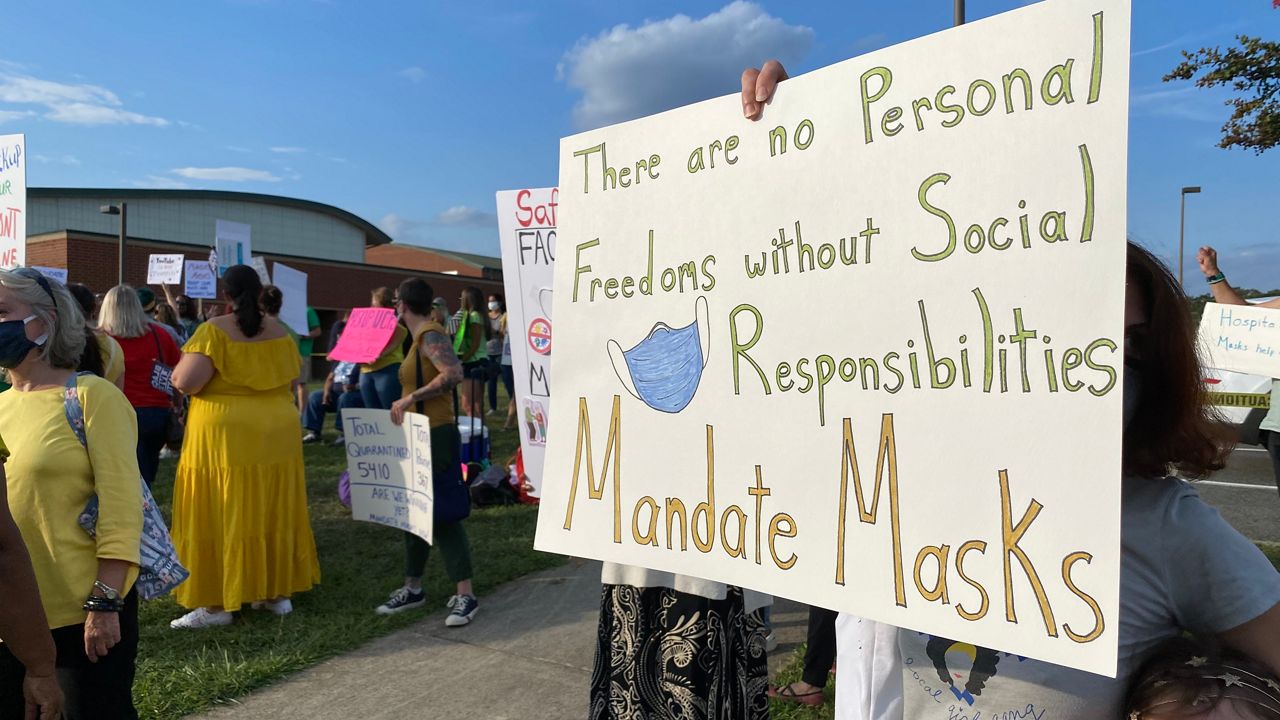 One of the signs at the pro-mandate protest outside Union County's BOE meeting
