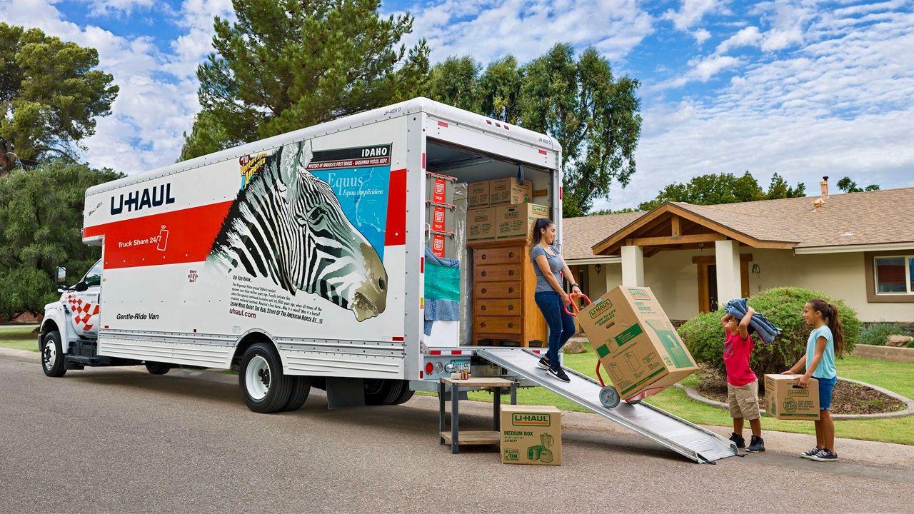 A family unloads stuff from a U-Haul van (Courtesy U-Haul) 