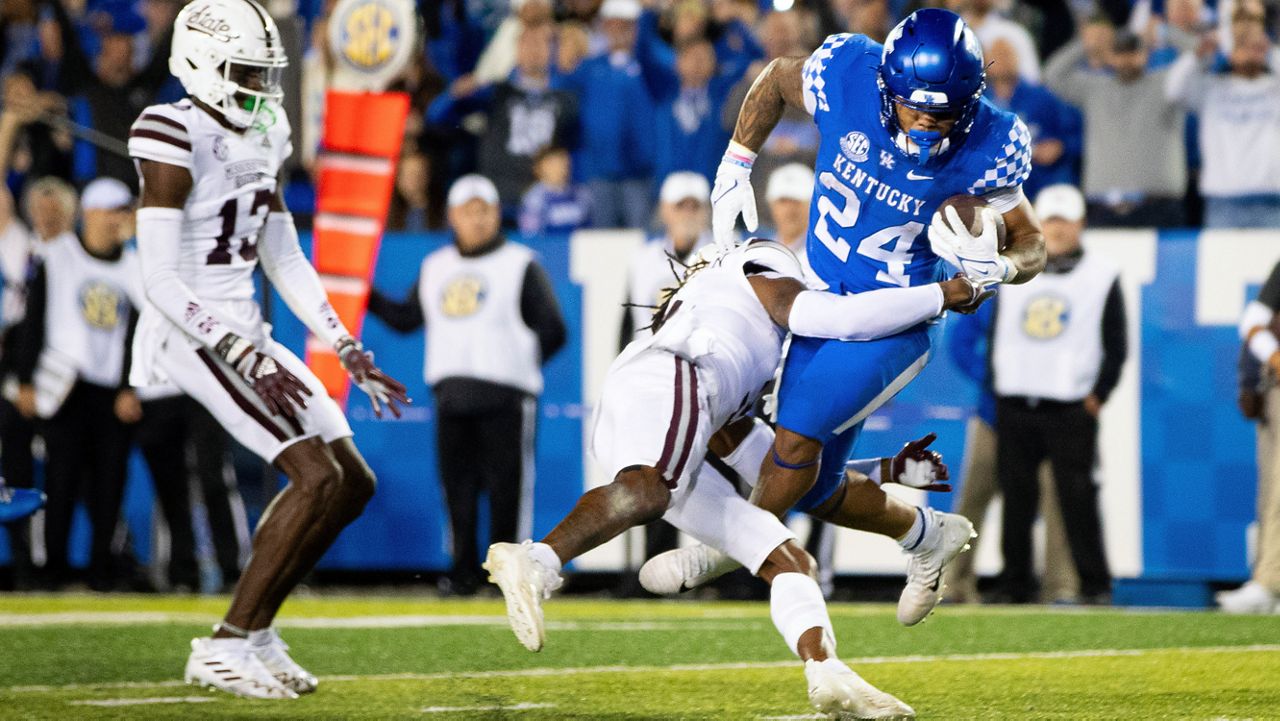 Kentucky running back Chris Rodriguez Jr. (24) is tackled into the end zone for a touchdown by Mississippi State defensive end Jordan Davis during the second half of an NCAA college football game in Lexington, Ky., Saturday, Oct. 15, 2022. (AP Photo/Michael Clubb)