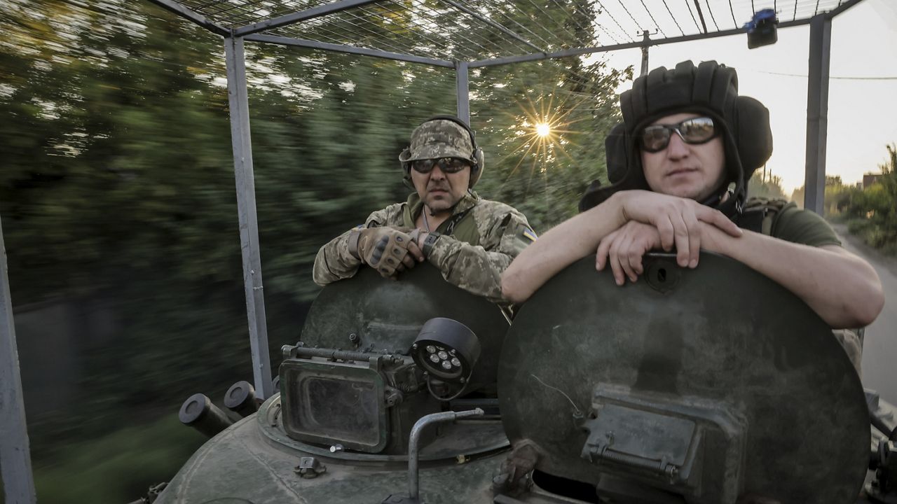 In this photo provided by Ukraine's 24th Mechanised Brigade press service, servicemen of 24th mechanised brigade ride a BRM1k infantry fighting vehicle near Chasiv Yar town, in Donetsk region, Ukraine, Saturday Aug. 17, 2024. (Oleg Petrasiuk/Ukrainian 24th Mechanised Brigade via AP)