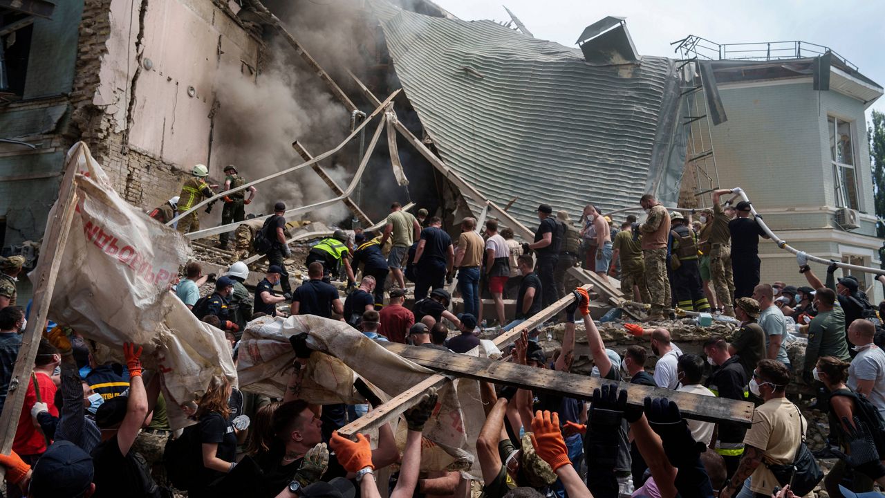 Rescue services at the site of Okhmatdyt children’s hospital hit by Russian missiles, in Kyiv, Ukraine. Monday, July 8, 2024. (AP Photo/Evgeniy Maloletka)