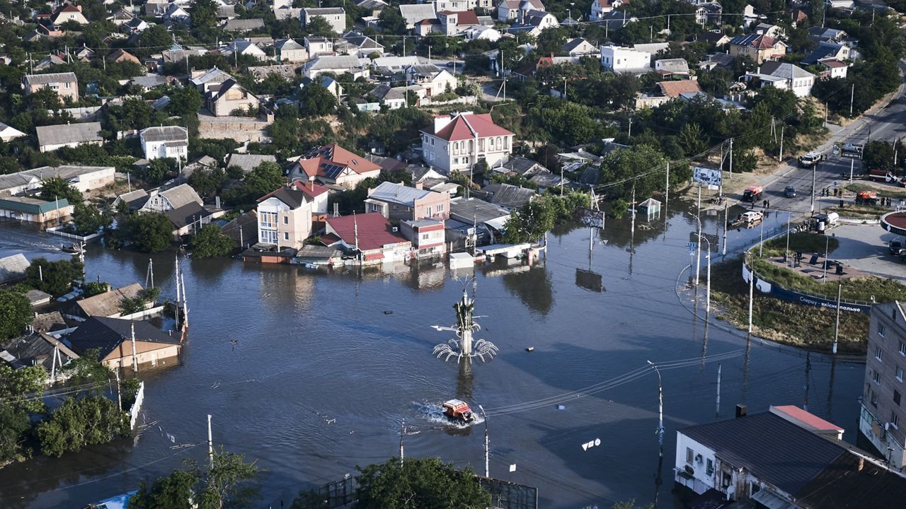 Streets are flooded in Kherson, Ukraine, on Wednesday after the Kakhovka dam collapsed. (AP Photo/Libkos)